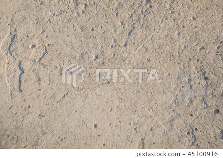 Closeup limestone rock face with weathered strata Closeup limestone rock face with weathered strata 45100916