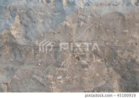 Closeup limestone rock face with weathered strata Closeup limestone rock face with weathered strata 45100919