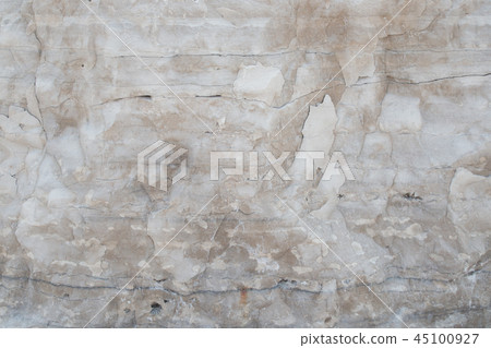Closeup limestone rock face with weathered strata 45100927