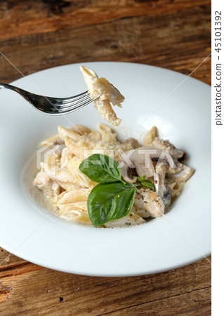 Fork with pasta 45101392