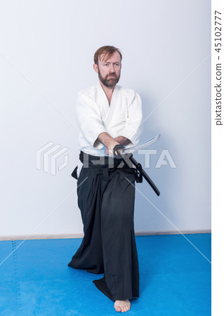 A man with katana on Iaido practice 45102777