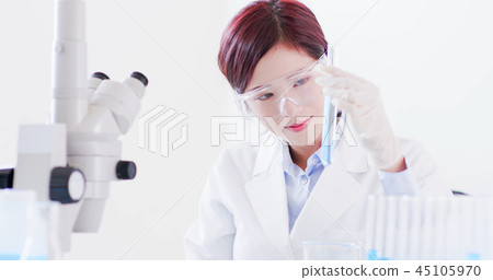 woman scientist take test tube 45105970