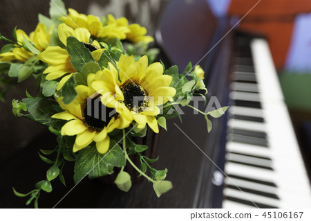 yellow bouquet in vase on the piano yellow bouquet in vase on the piano 45106167