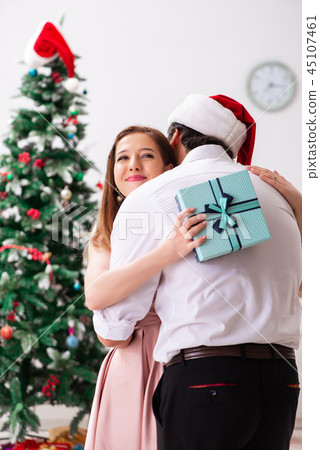 Young couple celebrating christmas at home 45107461