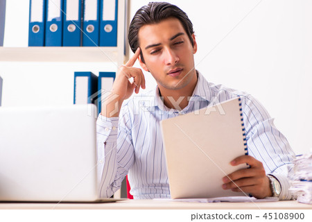 Young employee sitting at the office Young employee sitting at the office 45108900