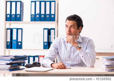 Young employee sitting at the office Young employee sitting at the office 45108902