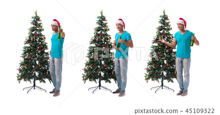 Young man decorating christmas tree isolated on white Young man decorating christmas tree isolated on white 45109322
