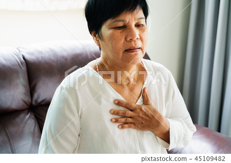 old woman having heart attack and grab her chest 45109482