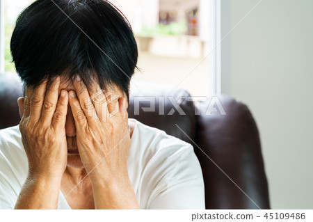 depressed woman, old woman hand close face unhappy 45109486