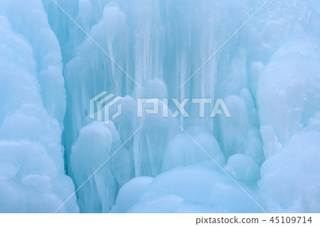 Texture of a frozen waterfall, background,  45109714