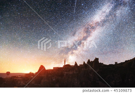 Fantastic starry sky and majestic mountains in the mist. Dramatic  beautiful morning. Autum 45109873