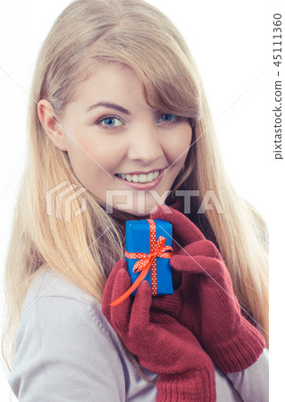 Vintage photo, Woman holding wrapped gift Vintage photo, Woman holding wrapped gift 45111360