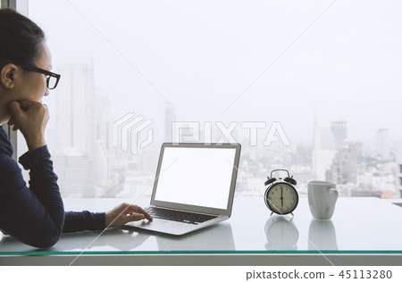 Women freelancer connecting to wireless via laptop Women freelancer connecting to wireless via laptop 45113280
