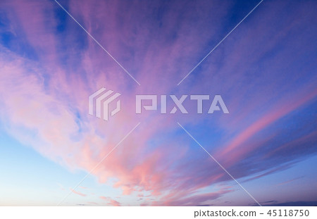 Pink orange clouds on the blue sky Pink orange clouds on the blue sky 45118750