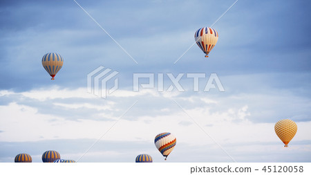 Group of air balloons flying in the sky 45120058