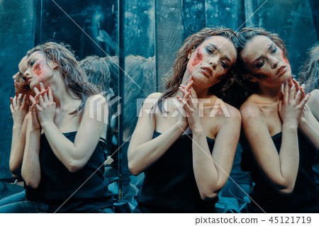 Beautiful girl with a scared face in the blood Beautiful girl with a scared face in the blood 45121719