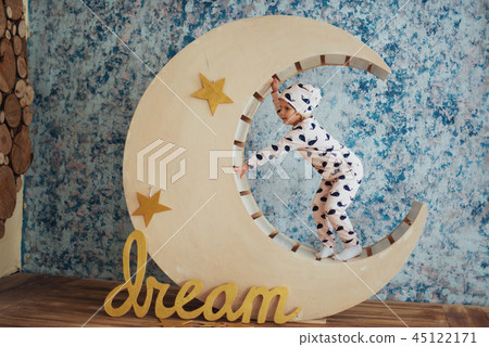 Child in soft and warm pajamas lying Child in soft and warm pajamas lying 45122171