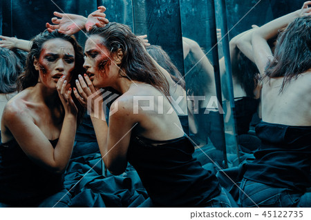 Beautiful girl with a scared face in the blood  45122735