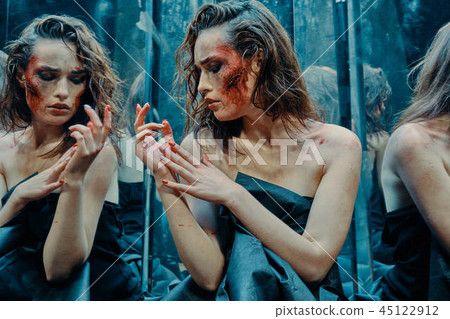 Beautiful girl with a scared face in the blood Beautiful girl with a scared face in the blood 45122912