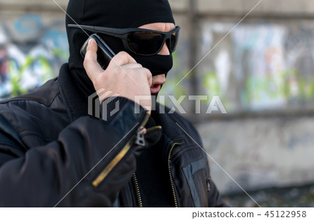 a bandit talking on the phone 45122958