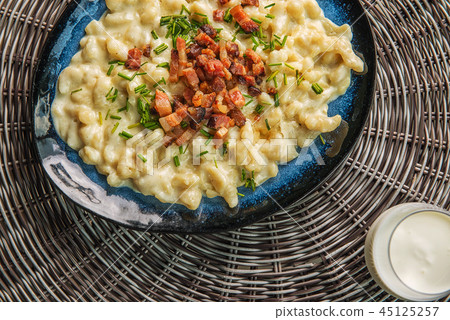 potato dumplings with sheep cheese and bacon 45125257