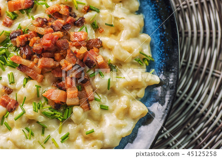 potato dumplings with sheep cheese and bacon 45125258