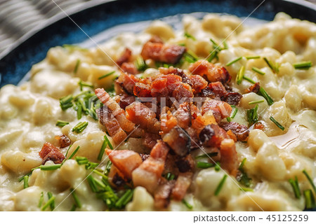 potato dumplings with sheep cheese and bacon 45125259