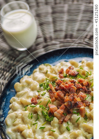 potato dumplings with sheep cheese and bacon 45125260