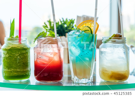 iced cocktail on wooden table 45125385