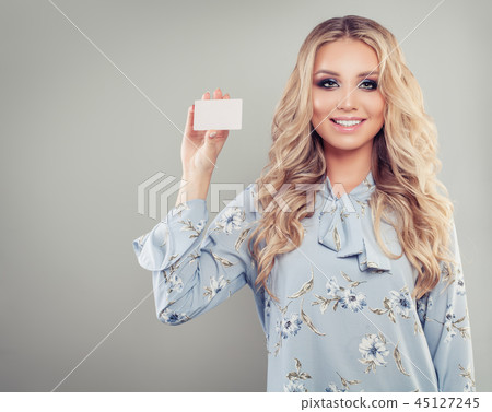 Happy successful woman holding credit card 45127245