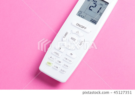 White remote control for air conditioning on a pink background close-up White remote control for air conditioning on a pink background close-up 45127351
