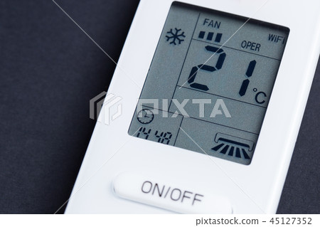White remote control for air conditioning on a black background close-up 45127352