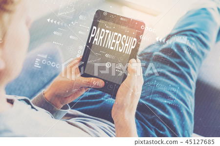 Partnership with man using a tablet Partnership with man using a tablet 45127685