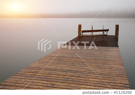 Empty footbridge with a bench on a lake Altausseer Empty footbridge with a bench on a lake Altausseer 45128200