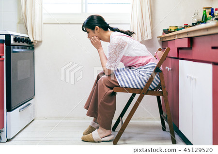 Housewife troubled housekeeping kitchen 45129520