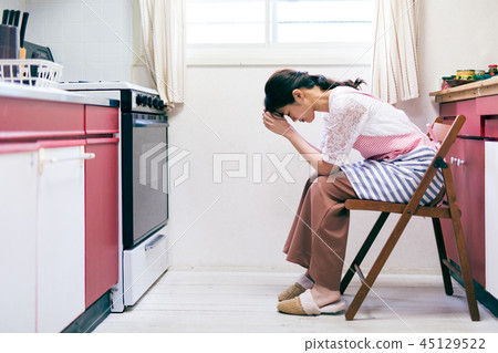 Housewife troubled housekeeping kitchen 45129522
