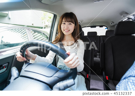 A woman driving a car A woman driving a car 45132337