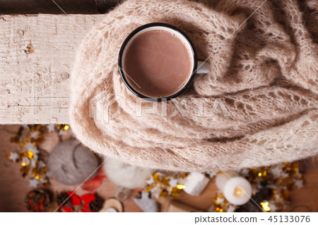 Cup of hot cocoa on rustic wooden bench Cup of hot cocoa on rustic wooden bench 45133076