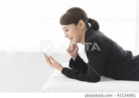 Woman relax smartphone 45134991