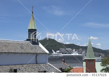 The steeple of Oura Tenshudo and Mt. Inasa The steeple of Oura Tenshudo and Mt. Inasa 45137028