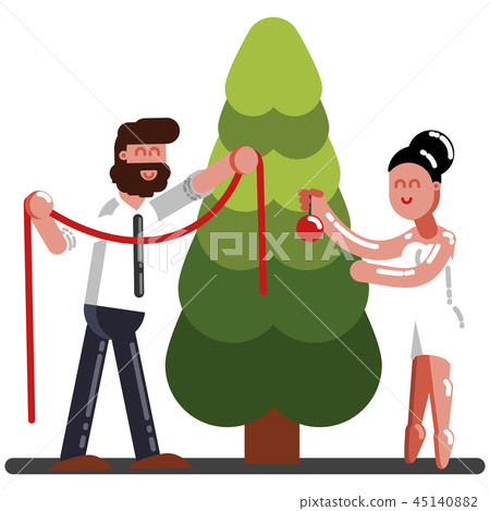 Couple adorns a New Year tree 45140882