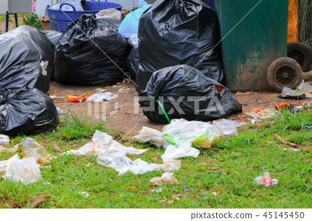 Pile black garbage bag roadside in the city Pile black garbage bag roadside in the city 45145450