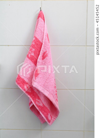 red towel for wipe hand in toliet room on wall red towel for wipe hand in toliet room on wall 45145452