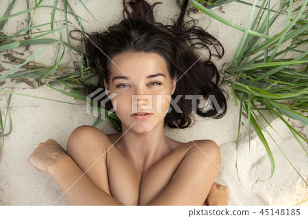 Nude beautiful woman on the nudist beach. Lady with nude perfect body. 45148185