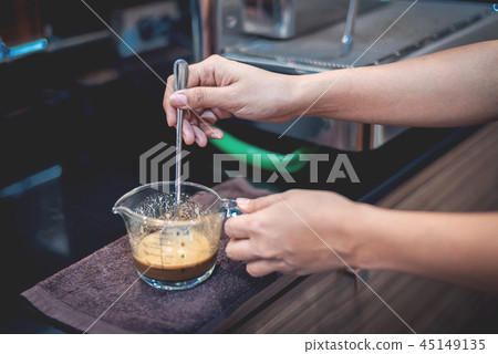 Barista preparing coffee for make iced coffee Barista preparing coffee for make iced coffee 45149135