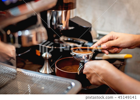 Barista preparing coffee beans grinded Barista preparing coffee beans grinded 45149141