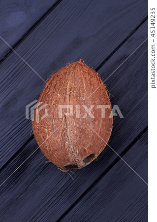 Fresh whole coconut fruit, top view. 45149235