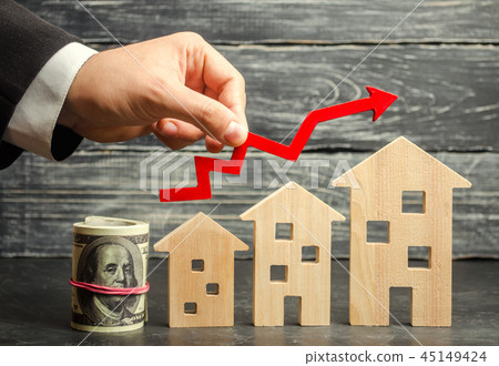 Wooden houses stand in a row from small 45149424