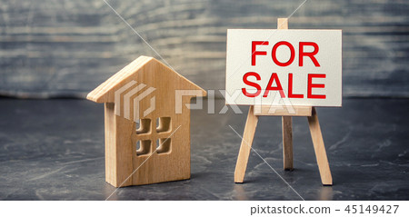 wooden house and dollars with the inscription 45149427