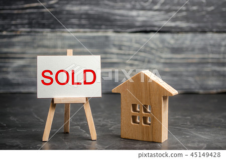 wooden house with the inscription "sold". wooden house with the inscription "sold". 45149428